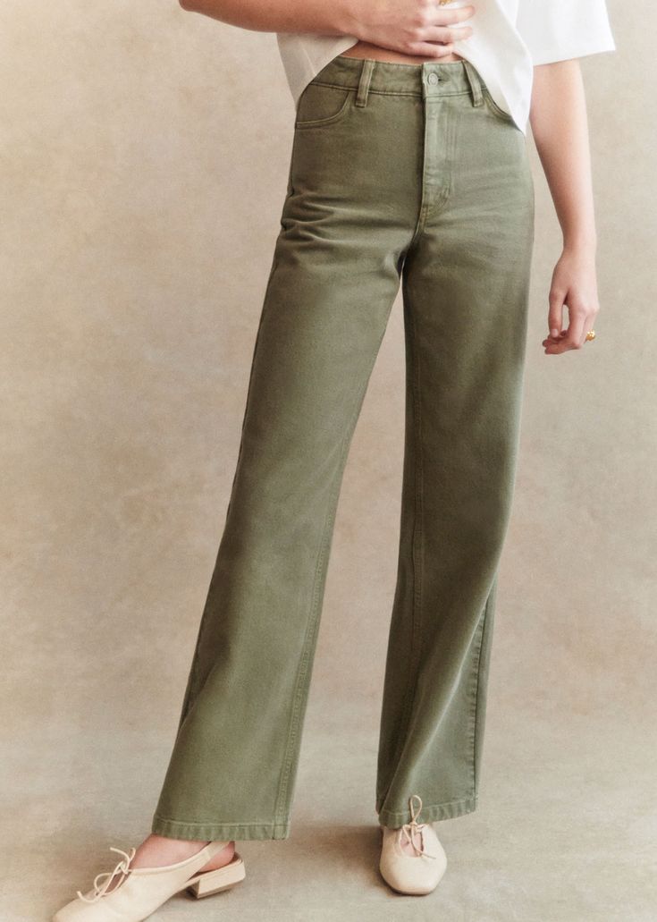 Olive green flared pants with white t-shirt.